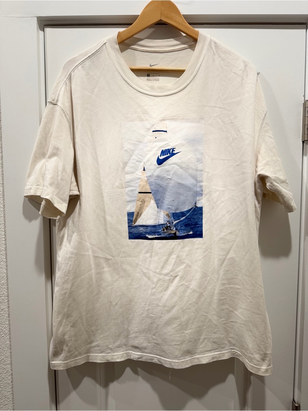 Nike Men’s Cream Graphic Sailboat Tee with Blue Logo